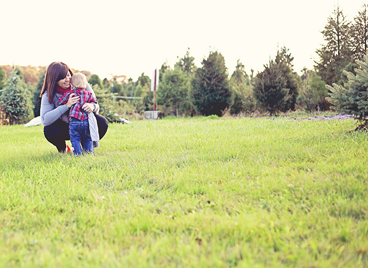 Christmas Tree Farm Family Photography Son hugging Mother