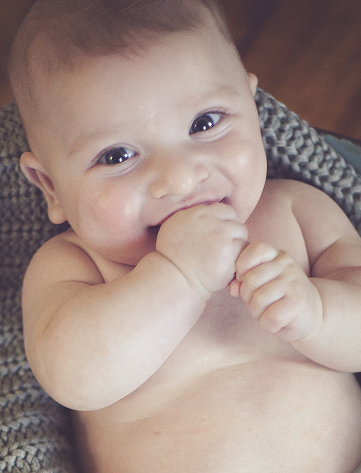 baby chewing hands